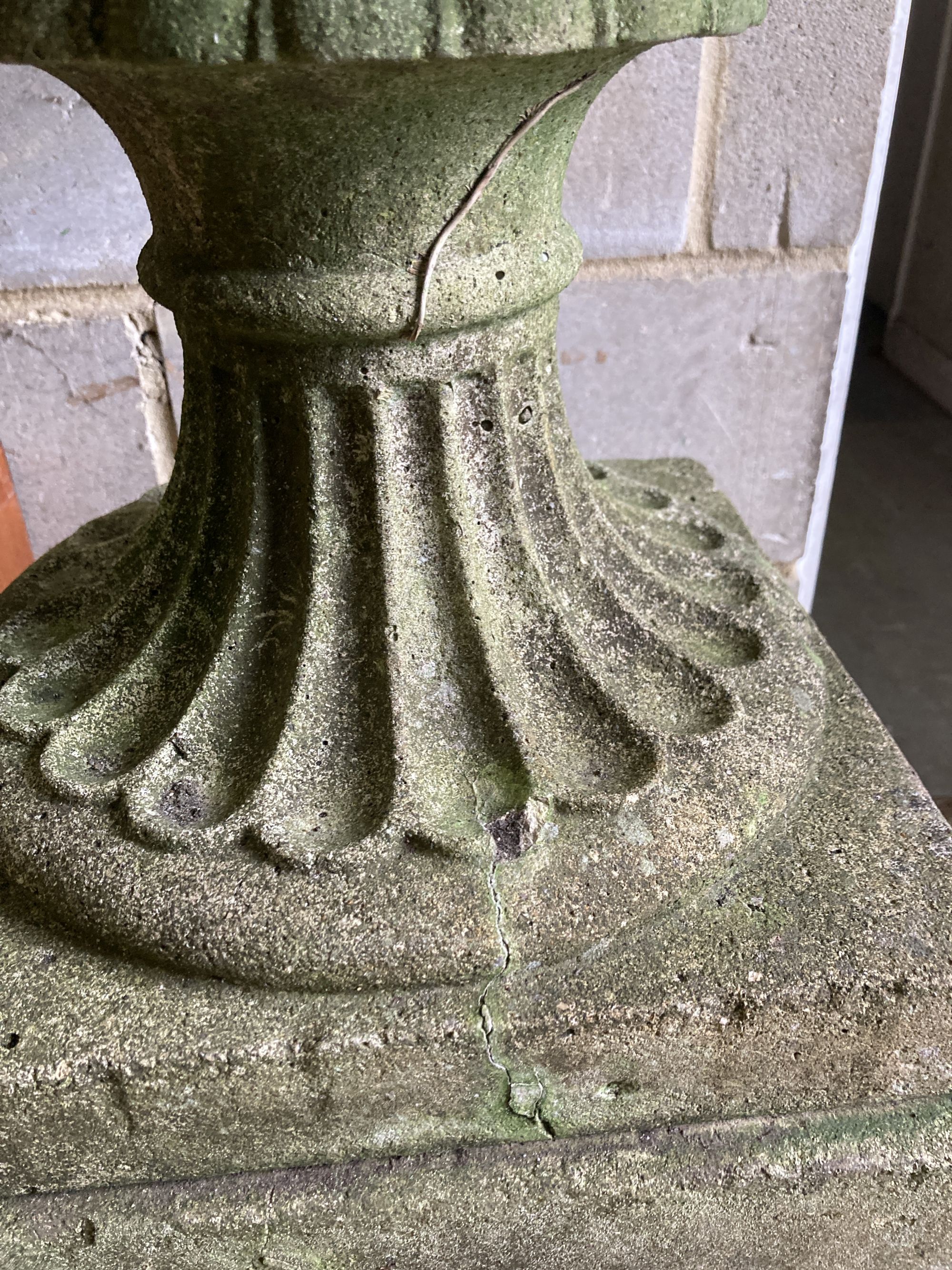 A reconstituted stone campana garden urn on pedestal, diameter 58cm, height 107cm